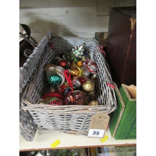 35 - WICKER BASKET WITH VINTAGE CHRISTMAS DECORATIONS AND NUTCRACKERS