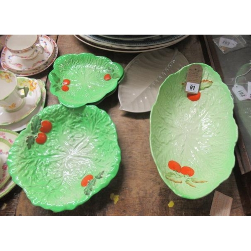 91 - FOUR CARTONWARE CABBAGE LEAF DISHES AND ANOTHER