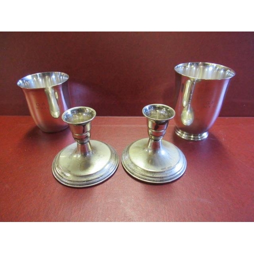 316 - PAIR OF SILVER CUPS AND TWO CANDLESTICKS