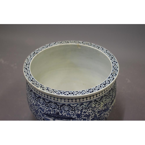 10 - A LARGE CHINESE PORCELAIN JARDINIERE of baluster form painted in underglaze blue with panels of flow... 