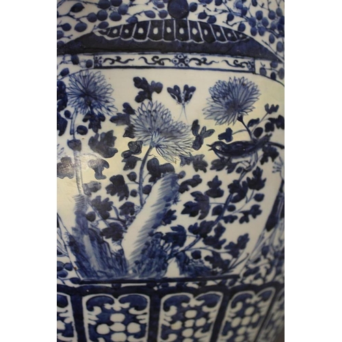 10 - A LARGE CHINESE PORCELAIN JARDINIERE of baluster form painted in underglaze blue with panels of flow... 