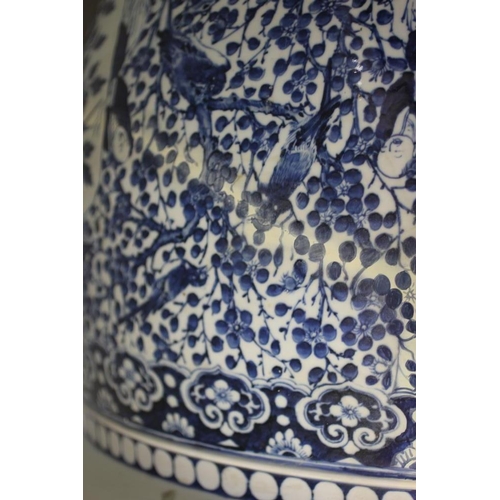 10 - A LARGE CHINESE PORCELAIN JARDINIERE of baluster form painted in underglaze blue with panels of flow... 