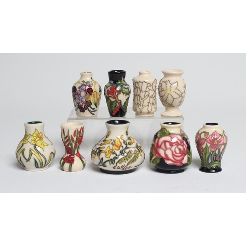 109 - A COLLECTION OF NINE MINIATURE MOORCROFT POTTERY VASES, comprising Heart to Heart, Christmas Crown, ... 