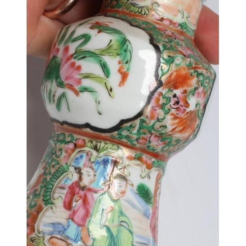 11 - A CANTONESE PORCELAIN FAMILLE ROSE SMALL GU VASE painted with panels of figures, flowers and birds o... 