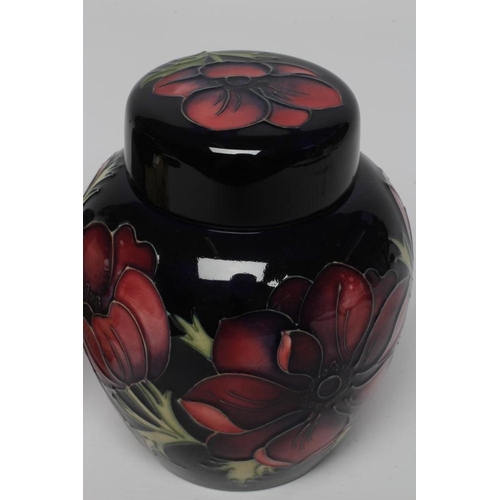 118 - TWO MOORCROFT POTTERY JARS AND COVERS, comprising Golden Jubilee designed by Emma Bossons, 2001, and... 