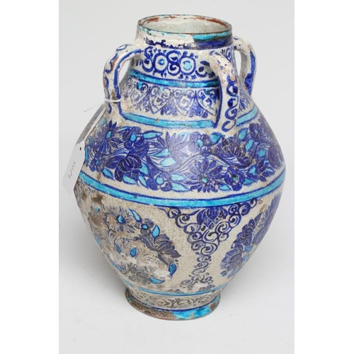 12 - AN INDIAN MULTAN TIN GLAZED EARTHENWARE JAR of conical form with four loop handles, painted in blue ... 