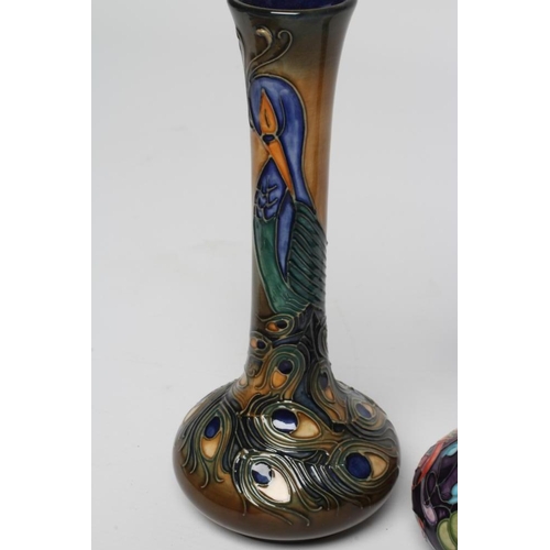 122 - A MOORCROFT POTTERY BOTTLE VASE, 1997, painted in colours with the Phoenix Peacock Feather pattern d... 