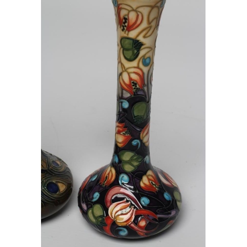 122 - A MOORCROFT POTTERY BOTTLE VASE, 1997, painted in colours with the Phoenix Peacock Feather pattern d... 