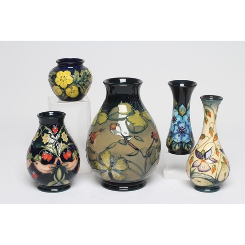 124 - FIVE MOORCROFT POTTERY VASES, comprising a Buttercup small vase, 1992, of rounded cylindrical form, ... 