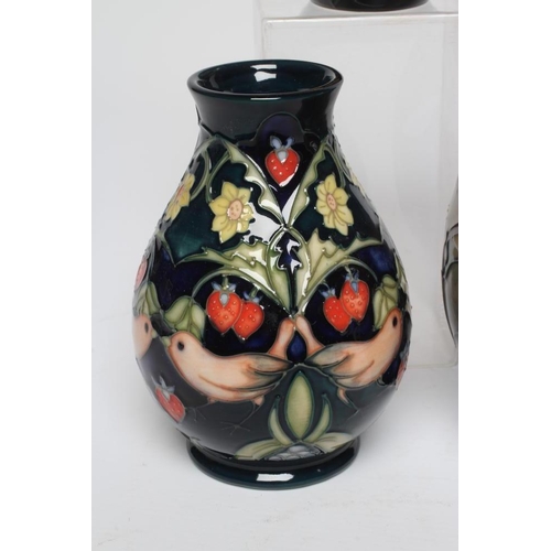 124 - FIVE MOORCROFT POTTERY VASES, comprising a Buttercup small vase, 1992, of rounded cylindrical form, ... 