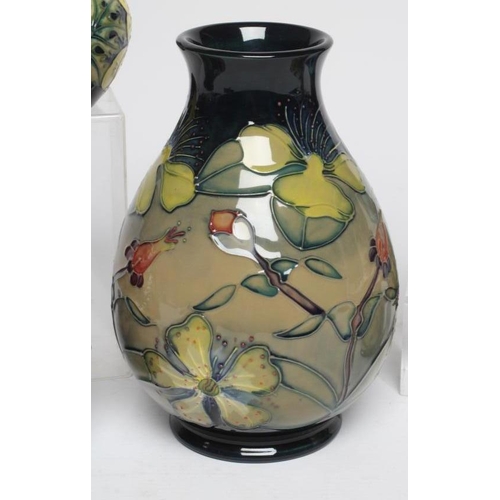 124 - FIVE MOORCROFT POTTERY VASES, comprising a Buttercup small vase, 1992, of rounded cylindrical form, ... 