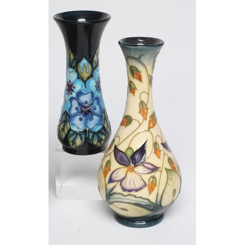 124 - FIVE MOORCROFT POTTERY VASES, comprising a Buttercup small vase, 1992, of rounded cylindrical form, ... 