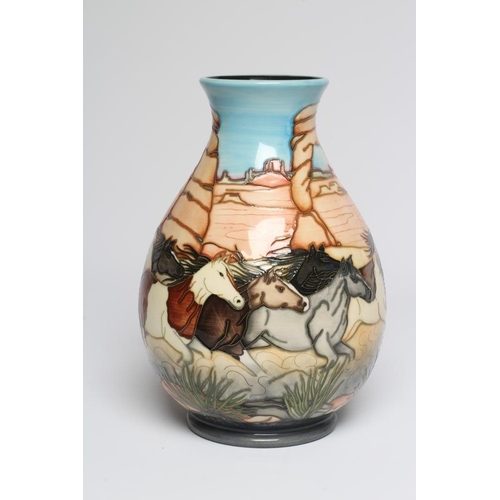 125 - A MOORCROFT POTTERY STAMPEDE TRIAL VASE, 2005, of baluster form, painted in colours designed by Paul... 