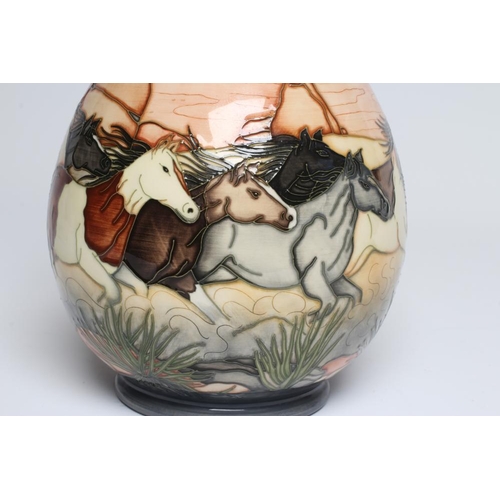 125 - A MOORCROFT POTTERY STAMPEDE TRIAL VASE, 2005, of baluster form, painted in colours designed by Paul... 