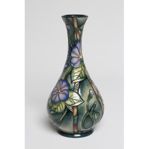 126 - A MOORCROFT POTTERY BOTTLE VASE, 2003, painted in colours with a version of The Love in a Mist patte... 