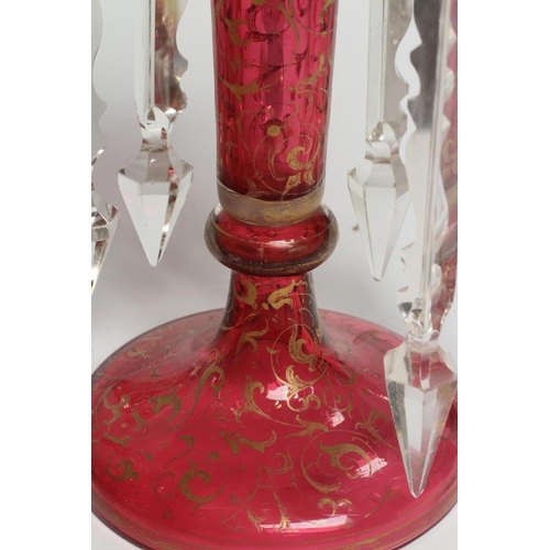 143 - A PAIR OF LATE 19TH CENTURY CRANBERRY GLASS LUSTRES, of typical form, the everted fold over rims ove... 