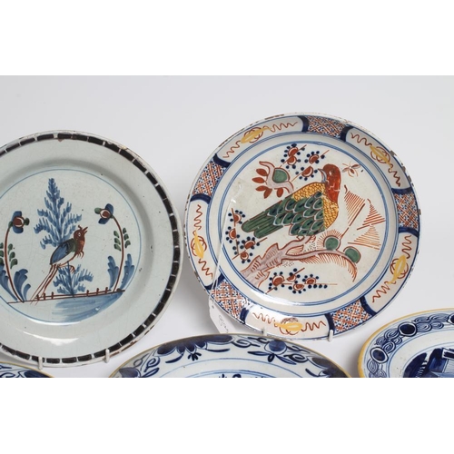 17 - A DUTCH DELFT DISH of plain circular form painted in polychrome enamels with a parrot perched upon a... 