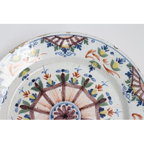 33 - A LONDON DELFT 'ANN GOMM' STYLE CHARGER, late 18th century, of plain circular form, painted in blue,... 