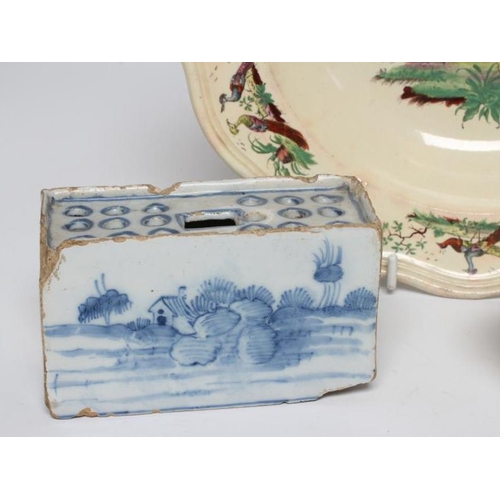 34 - AN ENGLISH DELFT FLOWER BRICK, c.1760, possibly Liverpool, of plain oblong form with eighteen pierce... 