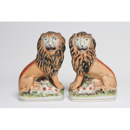 35 - A PAIR OF VICTORIAN STAFFORDSHIRE POTTERY VAN AMBURGH LION AND LAMB FLATBACK MODELS, well moulded an... 