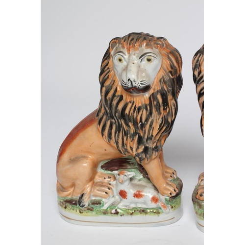 35 - A PAIR OF VICTORIAN STAFFORDSHIRE POTTERY VAN AMBURGH LION AND LAMB FLATBACK MODELS, well moulded an... 