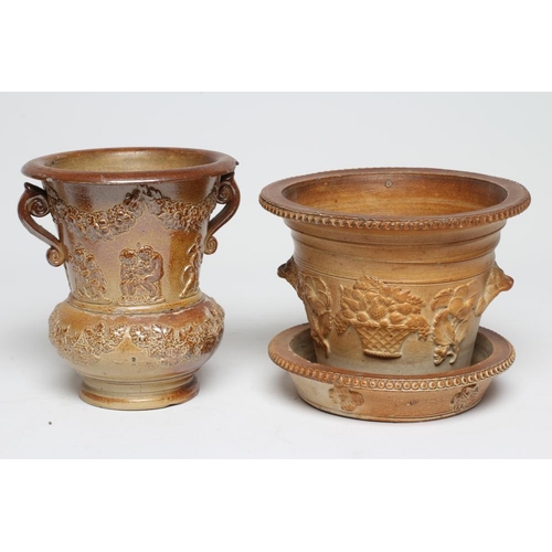 46 - A SALTGLAZE STONEWARE CACHE-POT AND STAND, early 19th century, of baluster form with two scroll hand... 