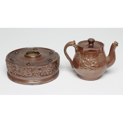 47 - A DOCUMENTARY BROWN SALTGLAZE STONEWARE CIRCULAR INKWELL, 1861, the central cylindrical well with ri... 