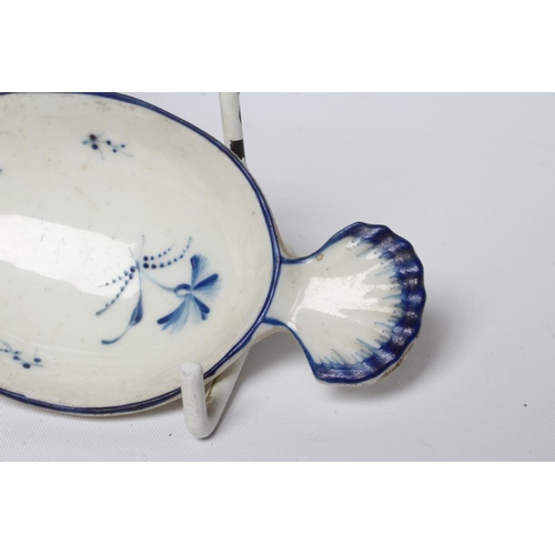 51 - A CAUGHLEY PORCELAIN CADDY SPOON, c.1790, the plain oval bowl with shell handle, painted in blue wit... 