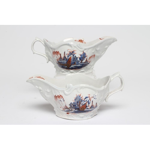 77 - A PAIR OF CHAFFERS PORCELAIN SAUCEBOATS, c.1770, with moulded scroll panels painted in underglaze bl... 