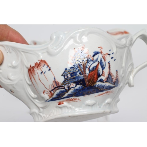 77 - A PAIR OF CHAFFERS PORCELAIN SAUCEBOATS, c.1770, with moulded scroll panels painted in underglaze bl... 