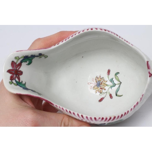 86 - A CHRISTIANS PORCELAIN SAUCE BOAT, 1770-78, of lobed oval pleat and floral moulded form, painted in ... 