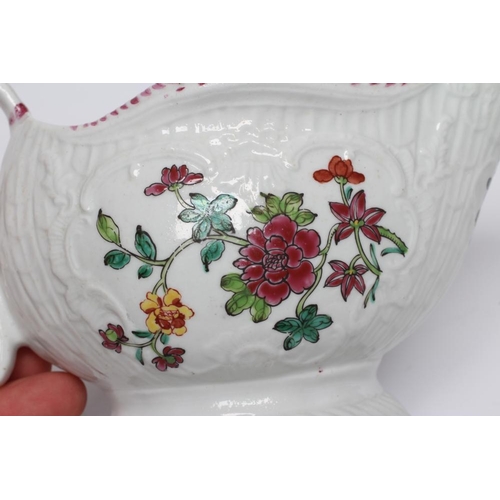 86 - A CHRISTIANS PORCELAIN SAUCE BOAT, 1770-78, of lobed oval pleat and floral moulded form, painted in ... 