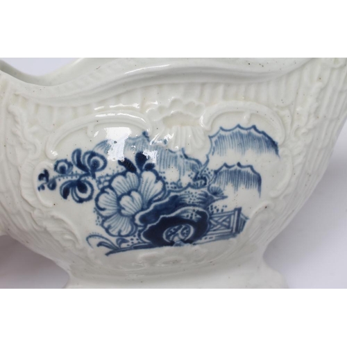 87 - A CHRISTIANS PORCELAIN SAUCE BOAT, 1768-78, of lobed oval form moulded with columns and over lapping... 