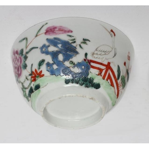 89 - A CHRISTIANS PORCELAIN TEA BOWL, 1765-68, painted in bright enamels with peony and holed rocks with ... 