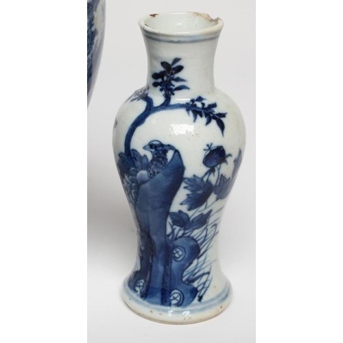 9 - THREE CHINESE PORCELAIN VASES, comprising a small pale blue glazed squat baluster vase with a salama... 