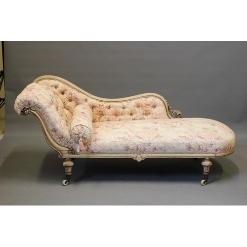 831 - A VICTORIAN WALNUT AND INLAID CHAISE LONGUE, button upholstered in pink and cream floral linen, serp... 