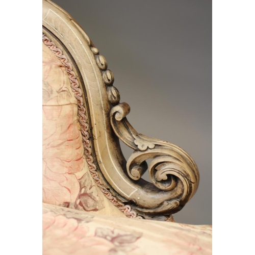 831 - A VICTORIAN WALNUT AND INLAID CHAISE LONGUE, button upholstered in pink and cream floral linen, serp... 