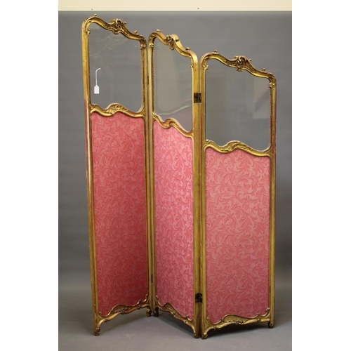 836 - A VICTORIAN GILT WOOD FOLDING ROOM SCREEN, in the rococo style with rocaille and foliate scrolls, th... 