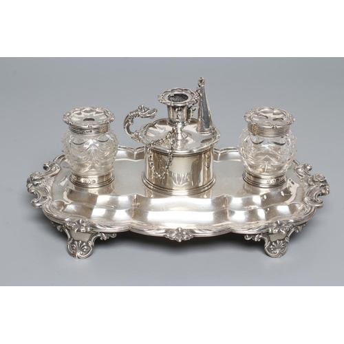 185 - A WILLIAM IV SILVER DESK STANDISH, maker's mark JA*IA, London 1831, of lobed oblong form with cast a... 