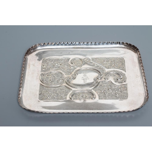 190 - A LATE VICTORIAN SILVER DRESSING TABLE TRAY, maker Huttons, Birmingham 1900, of rounded oblong form ... 