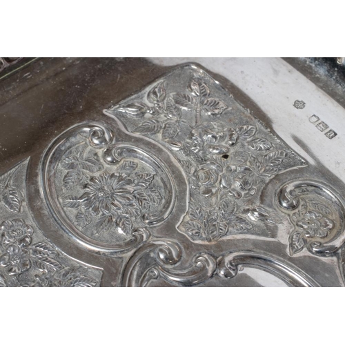 190 - A LATE VICTORIAN SILVER DRESSING TABLE TRAY, maker Huttons, Birmingham 1900, of rounded oblong form ... 