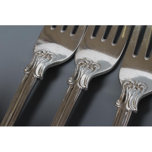 195 - A SET OF FOUR VICTORIAN SILVER TABLE FORKS, maker George Aldwinkle, London 1856, in double struck Vi... 