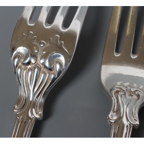 195 - A SET OF FOUR VICTORIAN SILVER TABLE FORKS, maker George Aldwinkle, London 1856, in double struck Vi... 