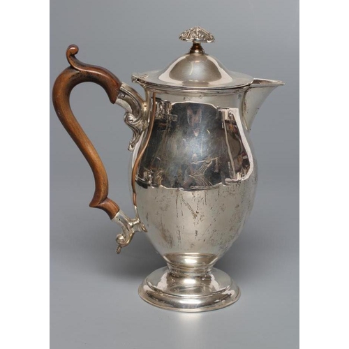 200 - A LATE VICTORIAN SILVER HOT WATER JUG, maker Huttons, London 1900, of baluster form, the hinged swep... 