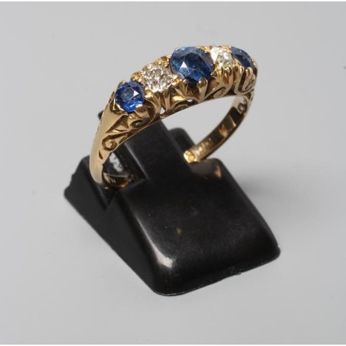 303 - A LATE VICTORIAN SAPPHIRE AND DIAMOND FIVE STONE RING, the three graduated sapphires and two diamond... 