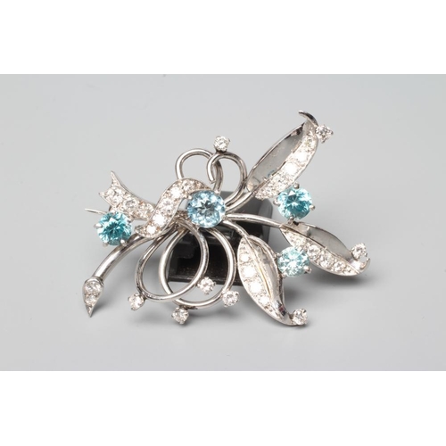 380 - A BLUE ZIRCON AND DIAMOND SPRAY BROOCH of open wirework form claw set with four facet cut zircons an... 