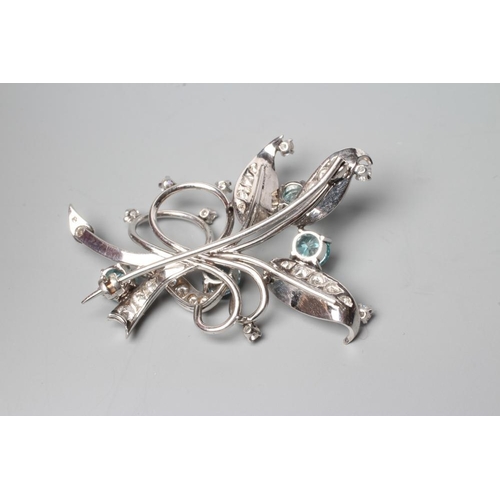 380 - A BLUE ZIRCON AND DIAMOND SPRAY BROOCH of open wirework form claw set with four facet cut zircons an... 