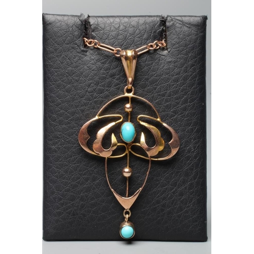 385 - AN EDWARDIAN ARTS AND CRAFTS PENDANT of quatrefoil form, centred by an oval polished turquoise caboc... 