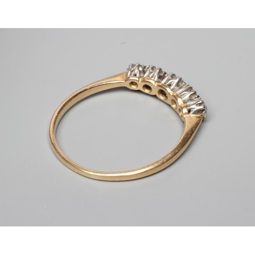 413 - A FIVE STONE DIAMOND HALF HOOP RING, the old cut stones claw set to a plain unmarked shank, size U (... 