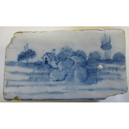 34 - AN ENGLISH DELFT FLOWER BRICK, c.1760, possibly Liverpool, of plain oblong form with eighteen pierce... 